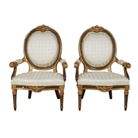 A Pair of Louis XVI style Carved Giltwood Fauteuils
