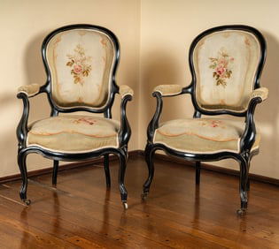 A Pair of Napoleon III Ebonized Wood Fauteuils