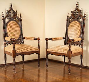 A Pair of American Gothic Revival Carved Oak Armchairs