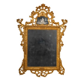 An Italian Rococo Giltwood and Etched Glass Mirror
