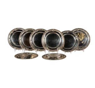 A Set of Eight Sanborns Mexican Sterling Chargers