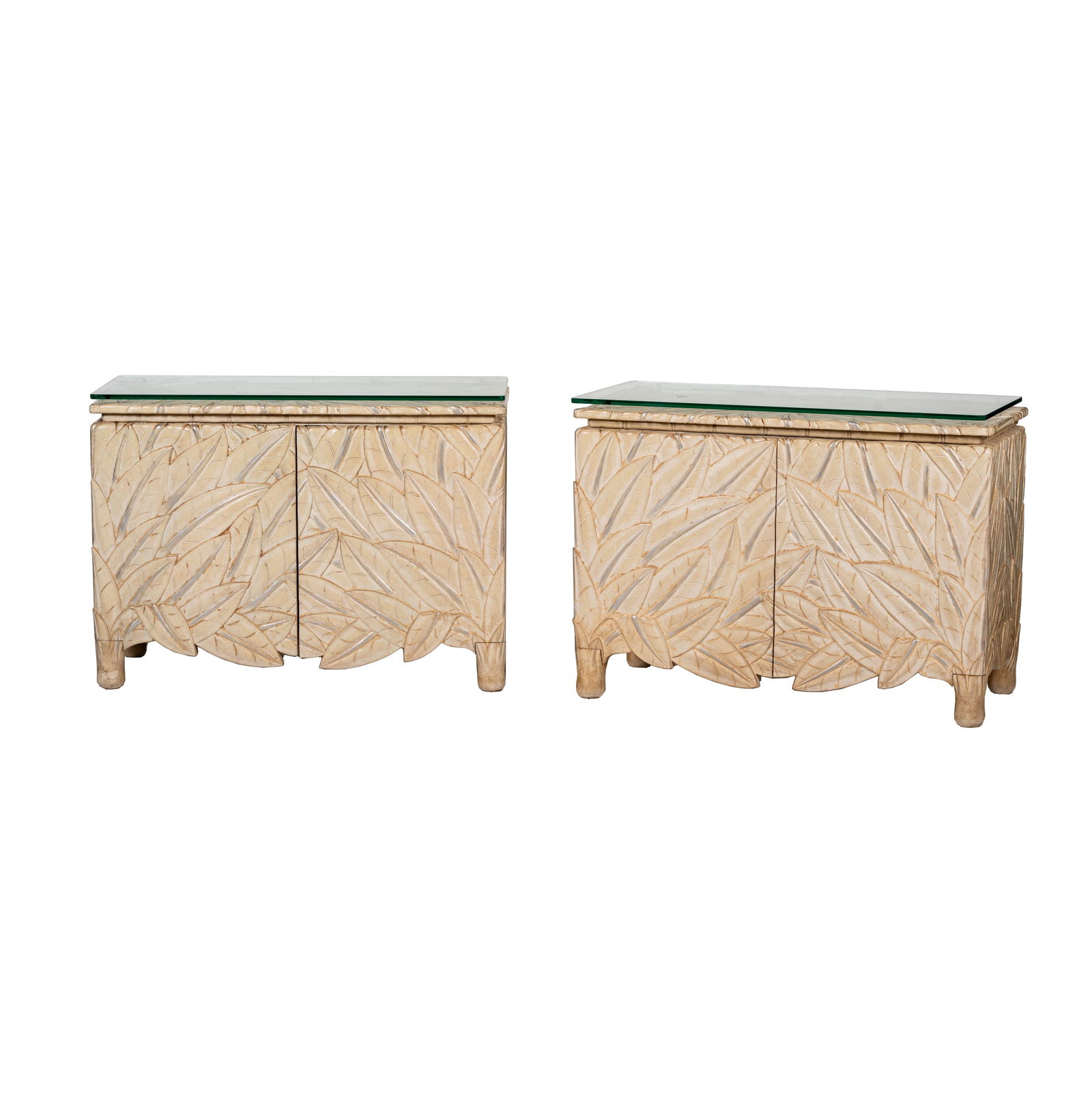 A Pair of Carved Bleached Wood Commodes: each with interior drawers and glass top; manufacturer unknown; Notes: This item does not qualify for in-house shipping. Please see our preferred shippers' list for quotes or arrange for local pickup.