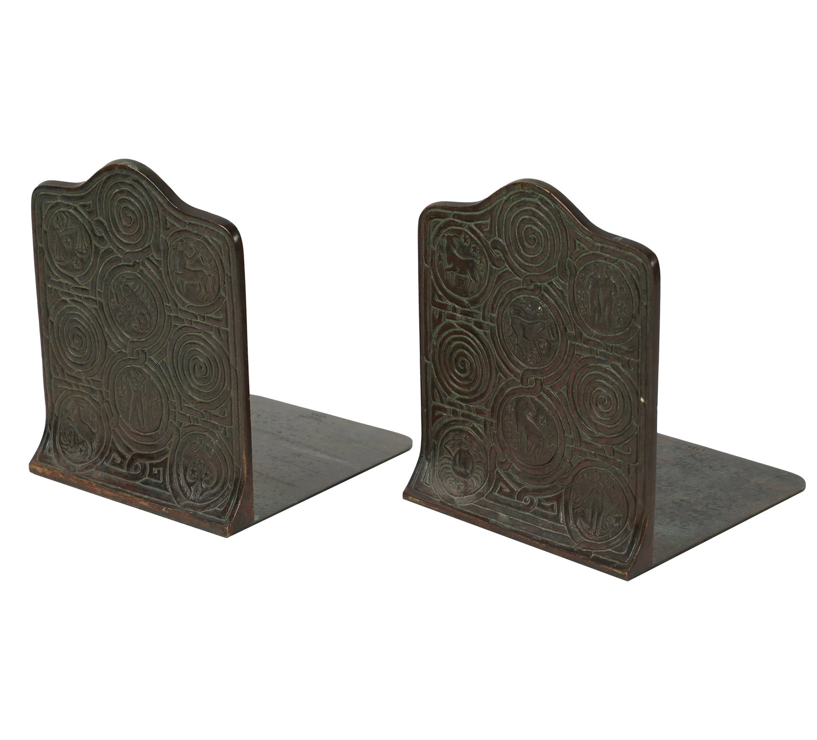 A Pair of Tiffany and Co. Zodiac Bronze Bookends: with original dark patination and original green felt underside; each marked; 6 x 4 3/4 x 5 1/2 in. (15.2 x 12.1 x 14 cm.); ;