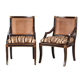 A Pair of Neoclassical-Style Ebonized and Gilt Armchairs