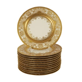 A Set of Twelve German Porcelain Chargers with Gilt Borders