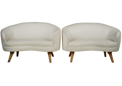 A Pair of Modernist Curved Sofas