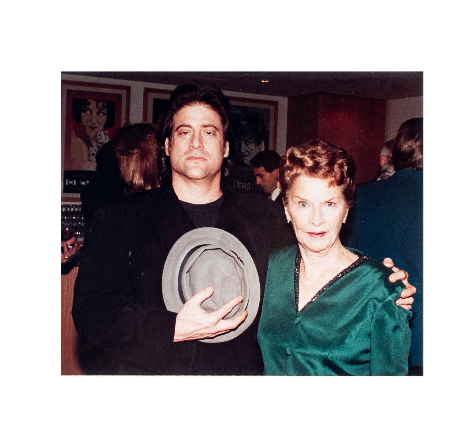 Richard Lewis and Eleanor Keaton Photo: color photograph with Richard holding one of Buster Keaton's famous hats 8 x 10 in. (20.3 x 25.4 cm.) Frame: 14 1/2 x 16 in. (36.8 x 40.6 cm.); From the Estate of Comedian and Actor Richard Lewis, Bel