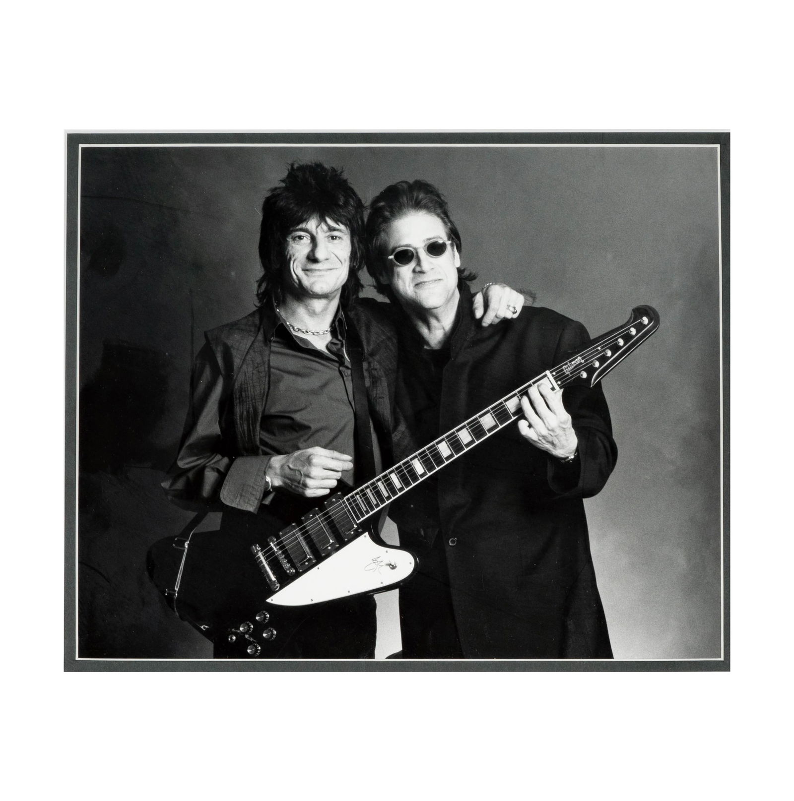 Ronnie Wood and Richard Lewis Framed Photo Display: framed photo with two of Ronnie Wood's guitar picks 8 x 10 in. (20.3 x 25.4 cm.) Frame: 13 1/2 x 15 1/4 in. (34.3 x 38.7 cm.); From the Estate of Comedian and Actor Richard Lewis, Beloved for His Icon