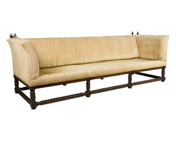An Upholstered Carved and Turned Wood Sofa Frame
