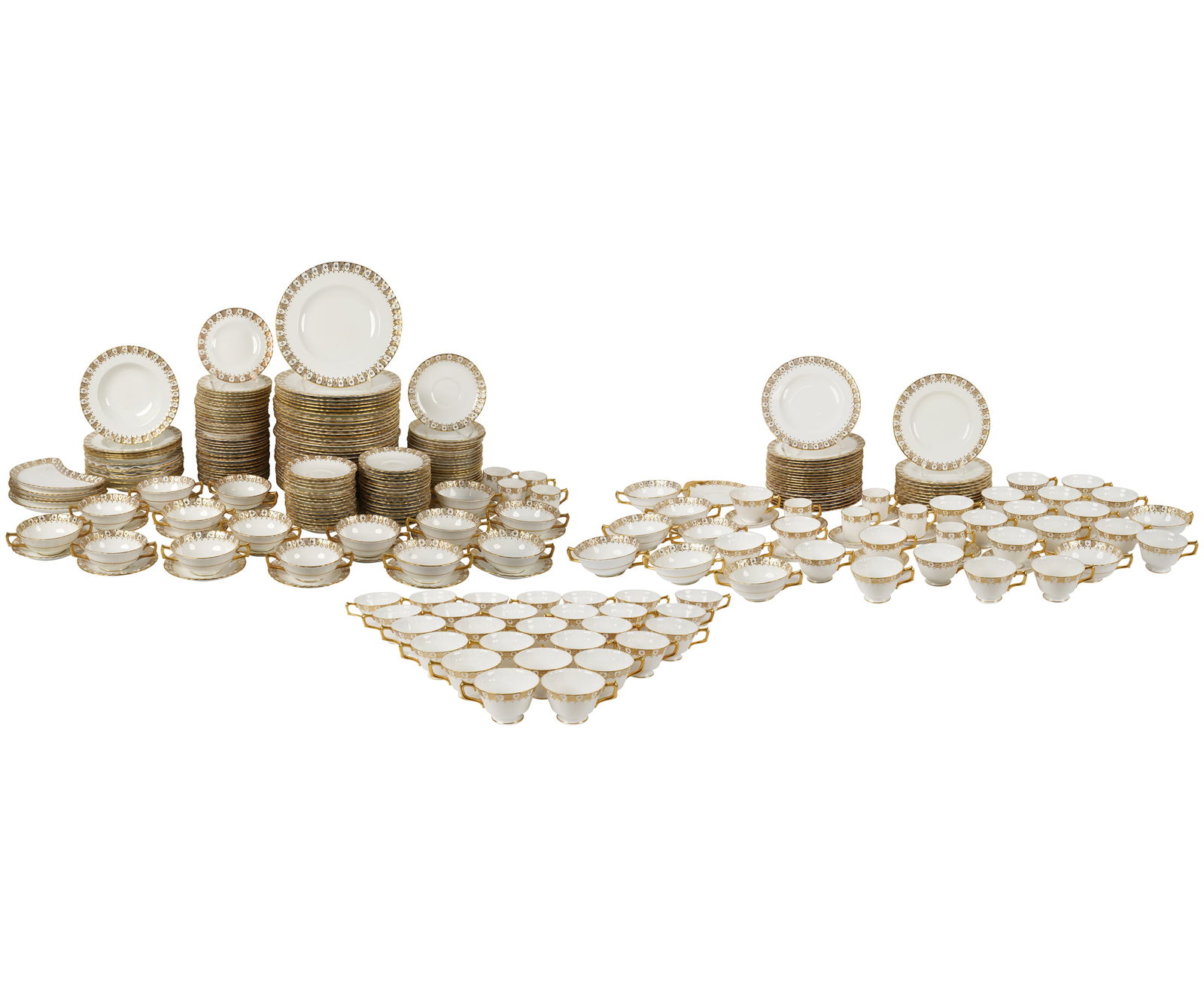 A Royal Crown Derby Heraldic Gold Porcelain Service: comprising 32 dinner plates, 31 round salad plates, five crescent salad plates, 31 bread plates, 12 soup plates, 24 cream soup bowls, 24 cream soup underplates, 48 teacups, 32 tea saucers, nine demita