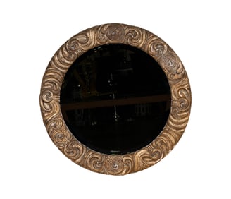 A Carved Giltwood Round Wall Mirror