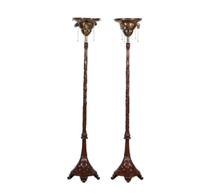 A Pair of Carved Wood Floor Lamps