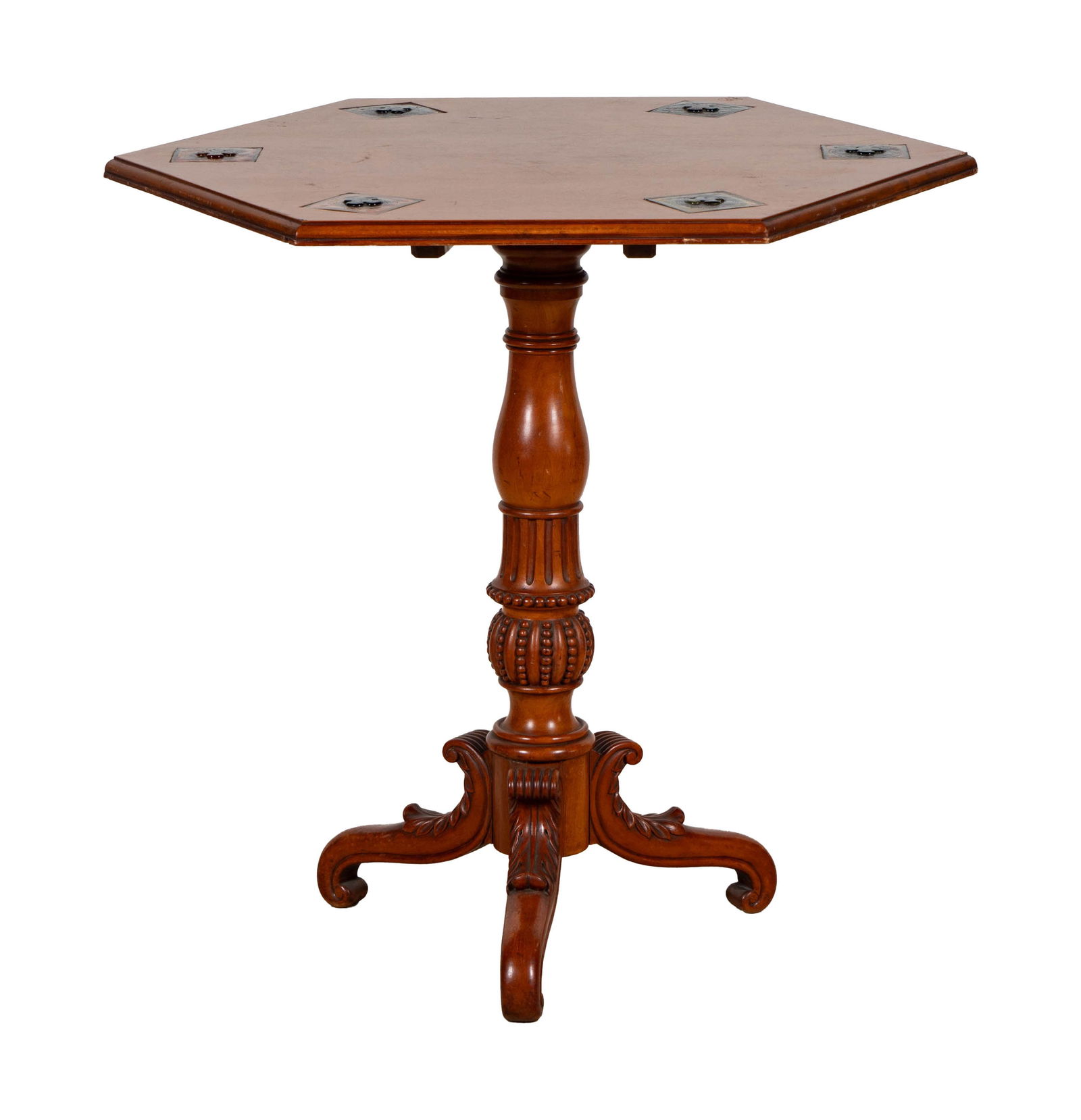 A Carved Tripod Table Inset With Tiffany Glass Tiles: the hexagonal top inset with six tiles 29 x 30 in. (73.7 x 76.2 cm.) Notes: This item does not qualify for in-house shipping. Please see our preferred shippers' list for quotes or arrange for local pi