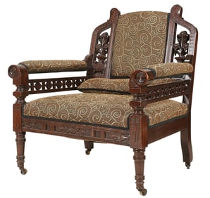 An Aesthetic Movement Carved Wood Armchair