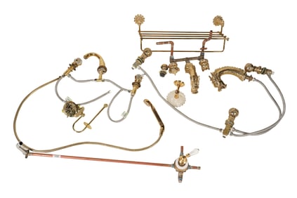 A Group of Brass Bathroom Plumbing Fixtures and Hardware