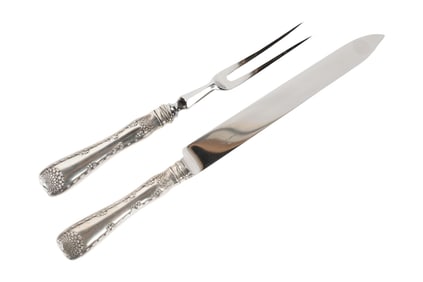 A Tiffany and Co. Wave Edge Sterling Carving Set