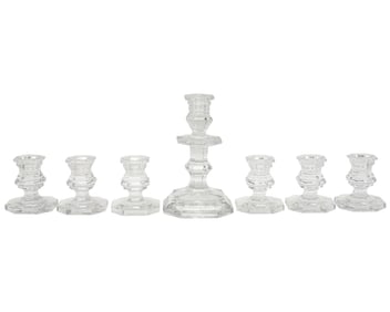 A Group of Seven Baccarat Regence Crystal Candlesticks