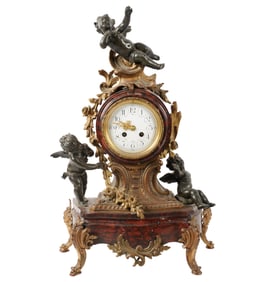 A French Gilt Metal and Rouge Marble Mantel Clock