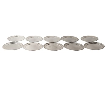 A Set of Twelve Peruvian .900 Silver Chargers