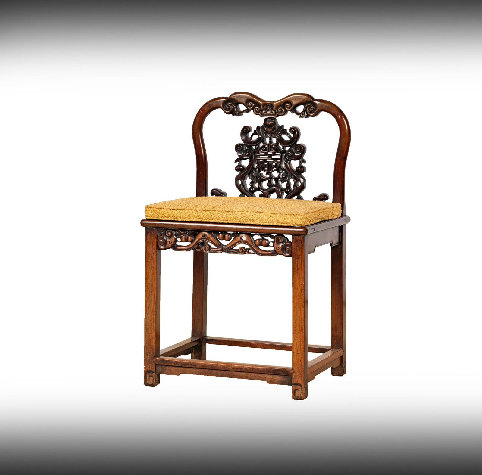 An Antique Chinese Carved Hardwood Side Chair: with pierced splat and seat rail 35 1/2 x 21 1/4 x 17 in. (90.2 x 54 x 43.2 cm.) Notes: This item does not qualify for in-house shipping. Please see our preferred shippers' list for quotes or arrange