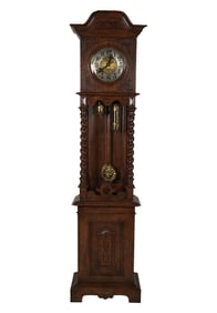 A Continental Renaissance Revival Carved Oak Longcase Clock