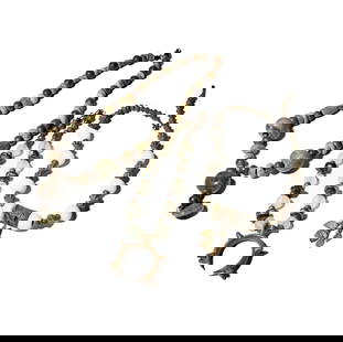 Three Green Stone Necklaces: with one glass bead necklace measuring 19-1/2 inches long, with metal pendant attached; and one stone beaded necklace with stone figure pendant measuring 26 inches long, and one quartz and metal