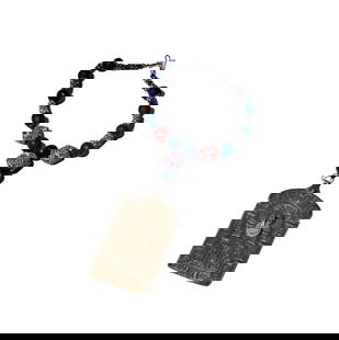 One Oriental Silver and Glass Bead Necklace: necklace measuring 18-1/2 inches in length; including one large panel pendant measuring 5-7/8 inches long by 2-7/8 inches wide, panel weighing approximately 59 grams; Provenance: From the Estate of