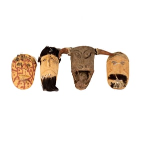 Four Carved Wood and Hide Masks