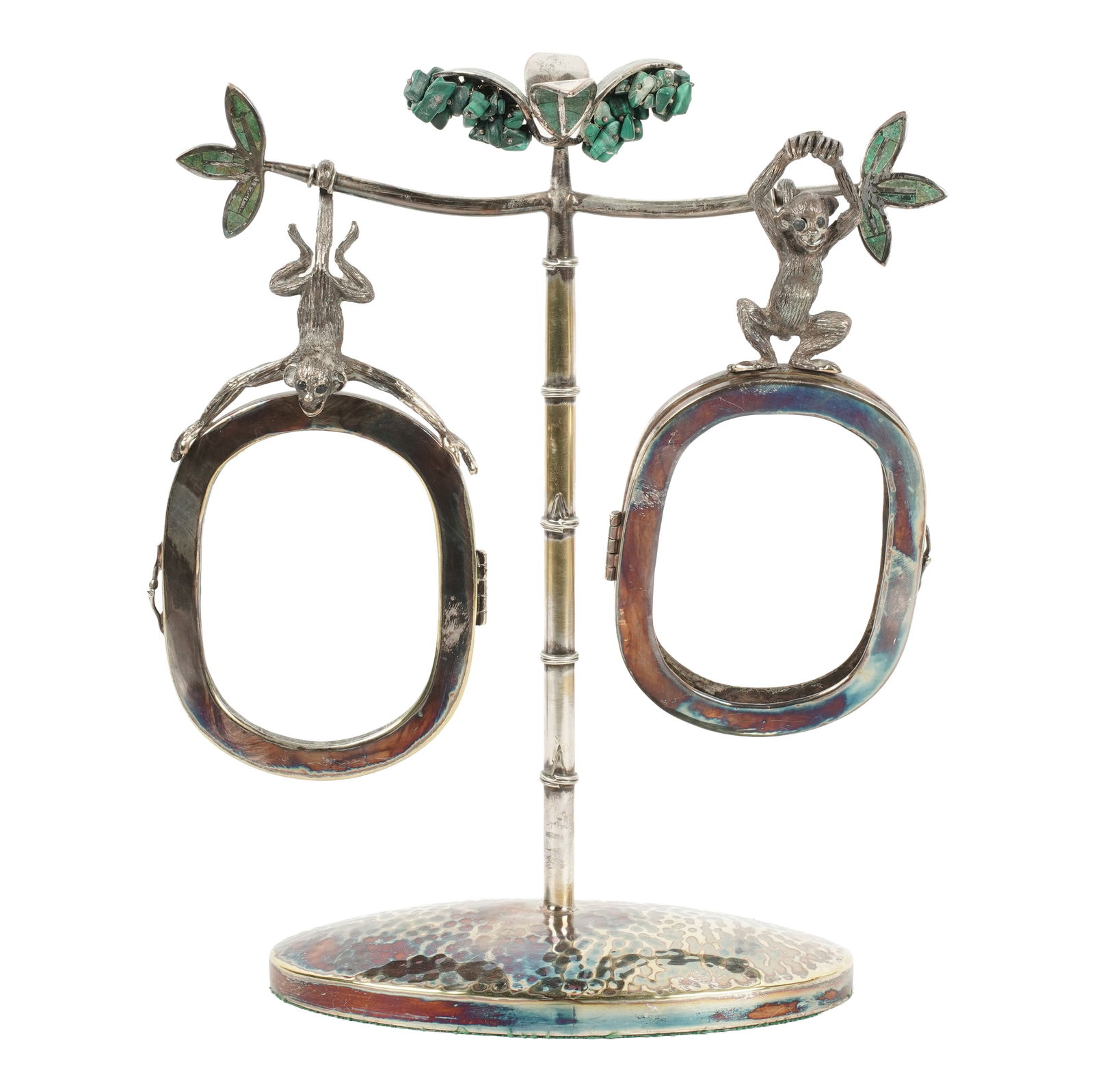 An Emilia Castillo Silverplate and Hardstone Double Picture Frame: cast with monkeys; marked to underside "Emilia Castillo / T0-85 / Mexico M.R. / Plateado" Overall: 10 3/4 x 9 1/2 x 3 3/4 in. (27.3 x 24.1 x 9.5 cm.)