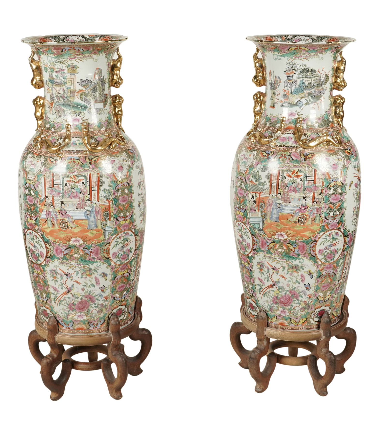 A Pair of Chinese Rose Medallion Porcelain Temple Vases: each with stand; unmarked 45 1/2 x 16 in. (115.6 x 40.6 cm.) Notes: This item does not qualify for in-house shipping. Please see our preferred shippers' list for quotes or arrange for local pickup. ht