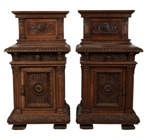 A Pair of Continental Renaissance Revival Carved Walnut Cabinets