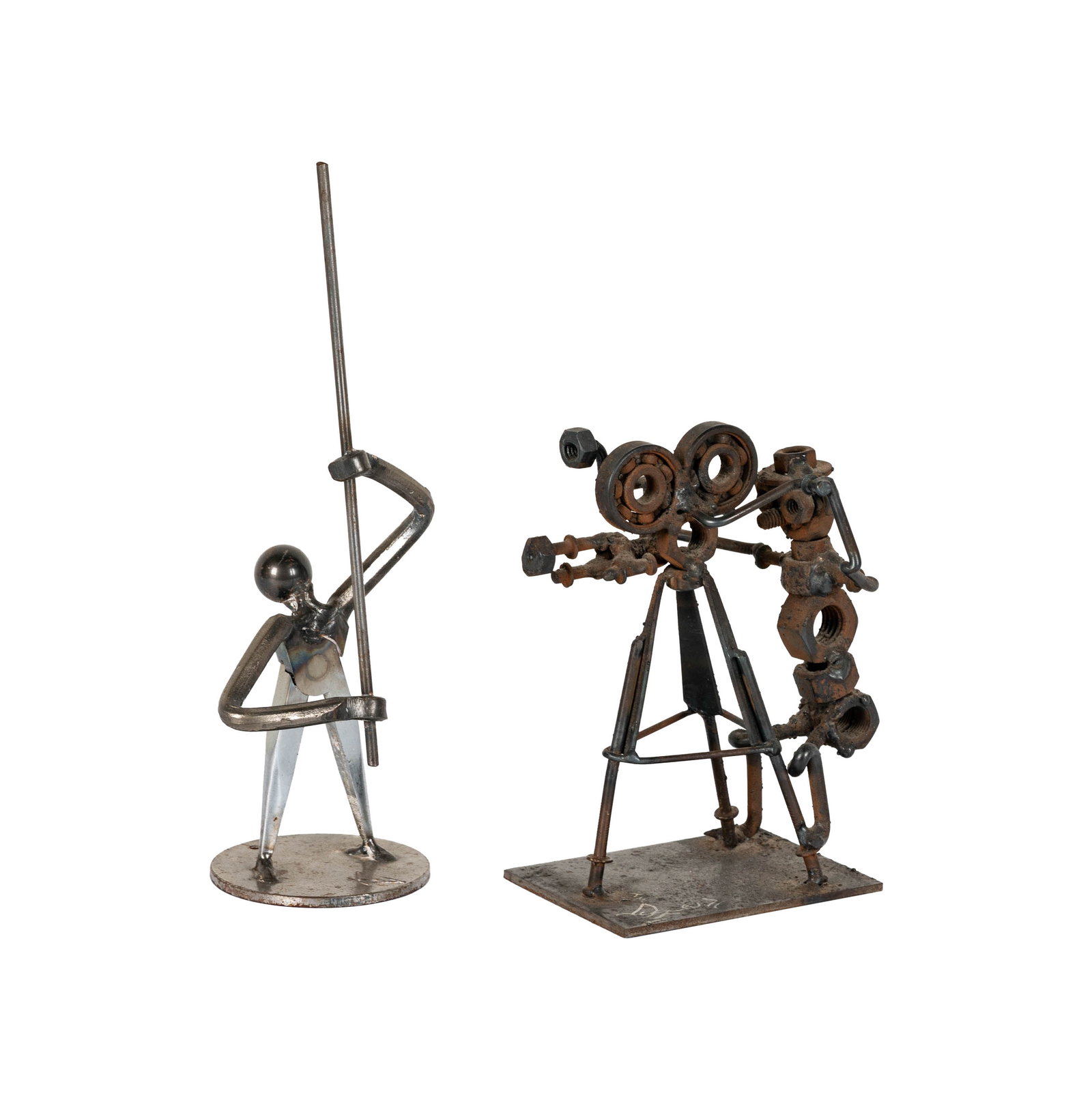 Two Steel Sculptures: each depicting a film crew member, each signed, one dated 1971 Tallest: 9 3/4 x 3 1/2 x 3 in. (24.8 x 8.9 x 7.6 cm.) Provenance: The Mark Canton Collection ? From the Acclaimed Producer & Former Studi