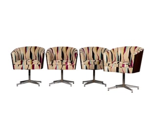 A Set of Four Directional Swivel Chairs