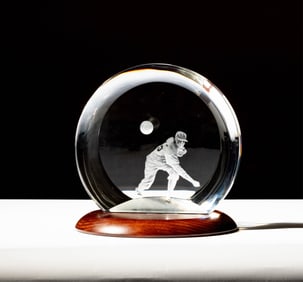A Steuben Glass Baseball Pitcher Sculpture