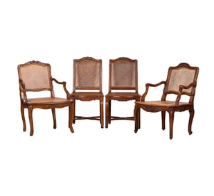 A Group of Four French Regence Walnut Chairs