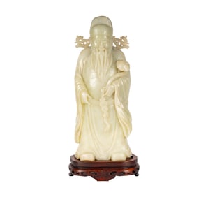A Chinese Carved White Jade Figure of Shou Lao