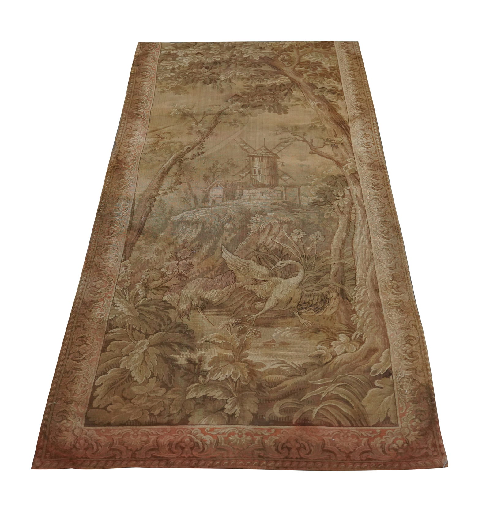 A Continental Tapestry: depicting a landscape with windmill; lined with fabric 101 x 49 in. (256.5 x 124.5 cm.)