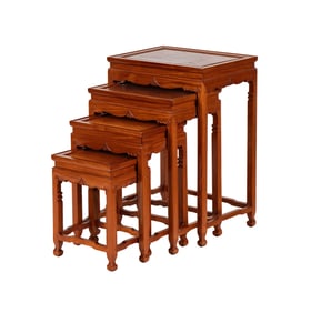 A Set of Four Asian-Style Carved Nesting Tables