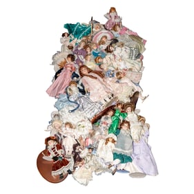 A Large Group of Vintage Porcelain Dolls