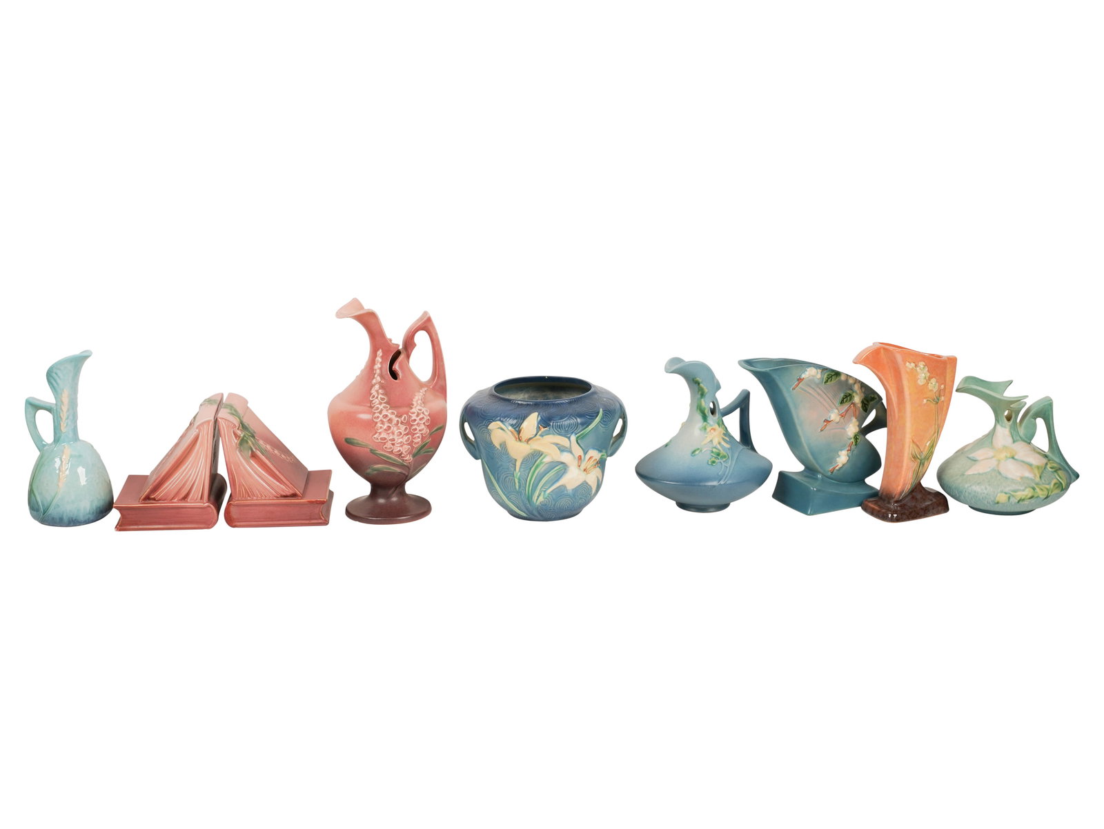 A Group of Roseville American Pottery Tableware: middle to late period Roseville pieces, comprising a pair of bookends, four pitchers, a two-handle vase, and two further vases; each marked to underside Large Pitcher: 10 3/4 x 5 1/2 in. (27.3 x 14 cm