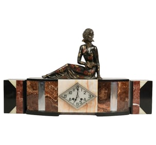 A French Art Deco Figural Three-Piece Mantle Clock