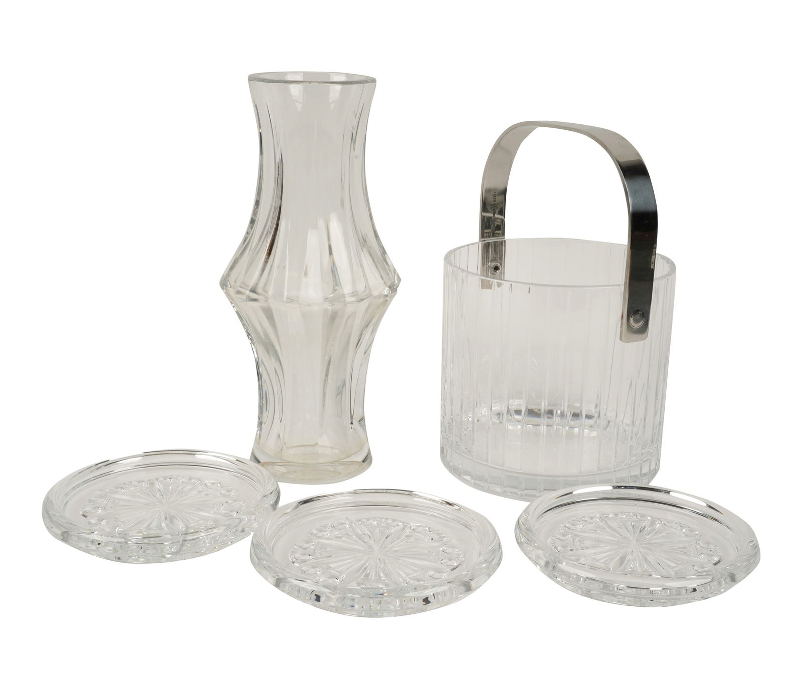 A Group of Five Baccarat Crystal Table Articles: comprising an ice bucket, a vase, and three wine bottle coasters, each signed Ice bucket: 5 1/2 x 5 3/4 in. (14 x 14.6 cm.) Vase: 10 in. high (25.4 cm.)