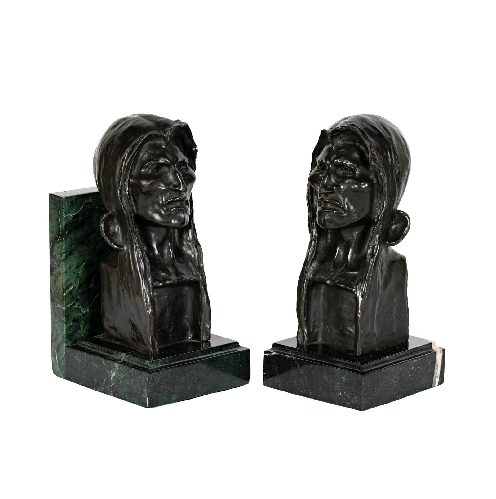 After Frederic Remington, 1861-1909, Pair of Bookends: bronze, mounted to marble signed Each overall: 12 3/4 x 6 x 6 in. (32.4 x 15.2 x 15.2 cm.)