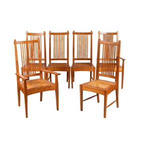 A Set of Six Teak Dining Chairs