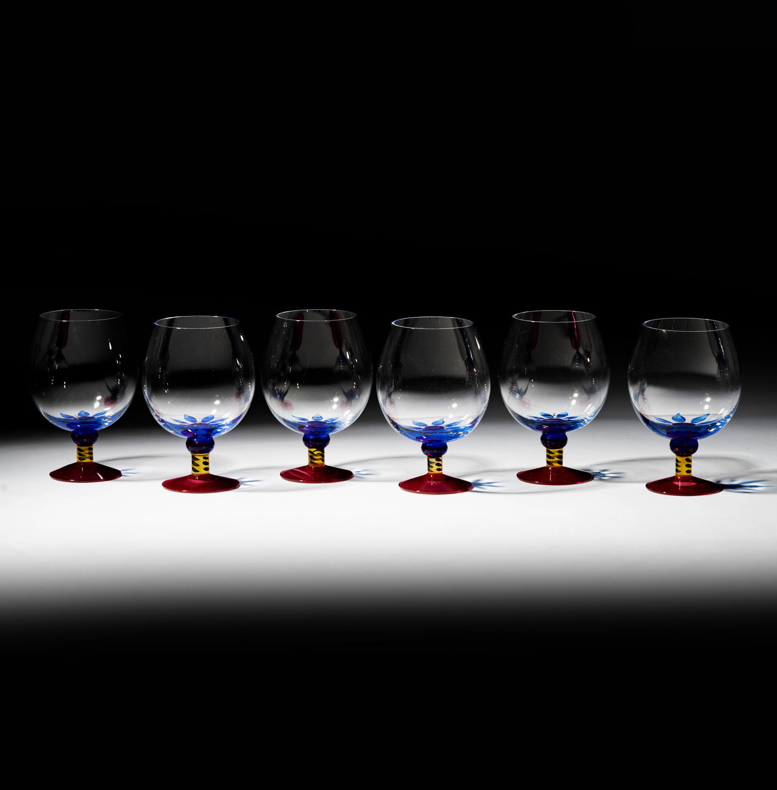 A Set of Six Kosta Boda Painted Glass Snifters: each marked "Kosta Boda" and with painted mark "KD/LL" 6 1/4 in. (15.9 cm.) high