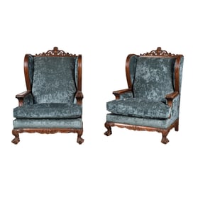 A Pair of Carved Wing Chairs