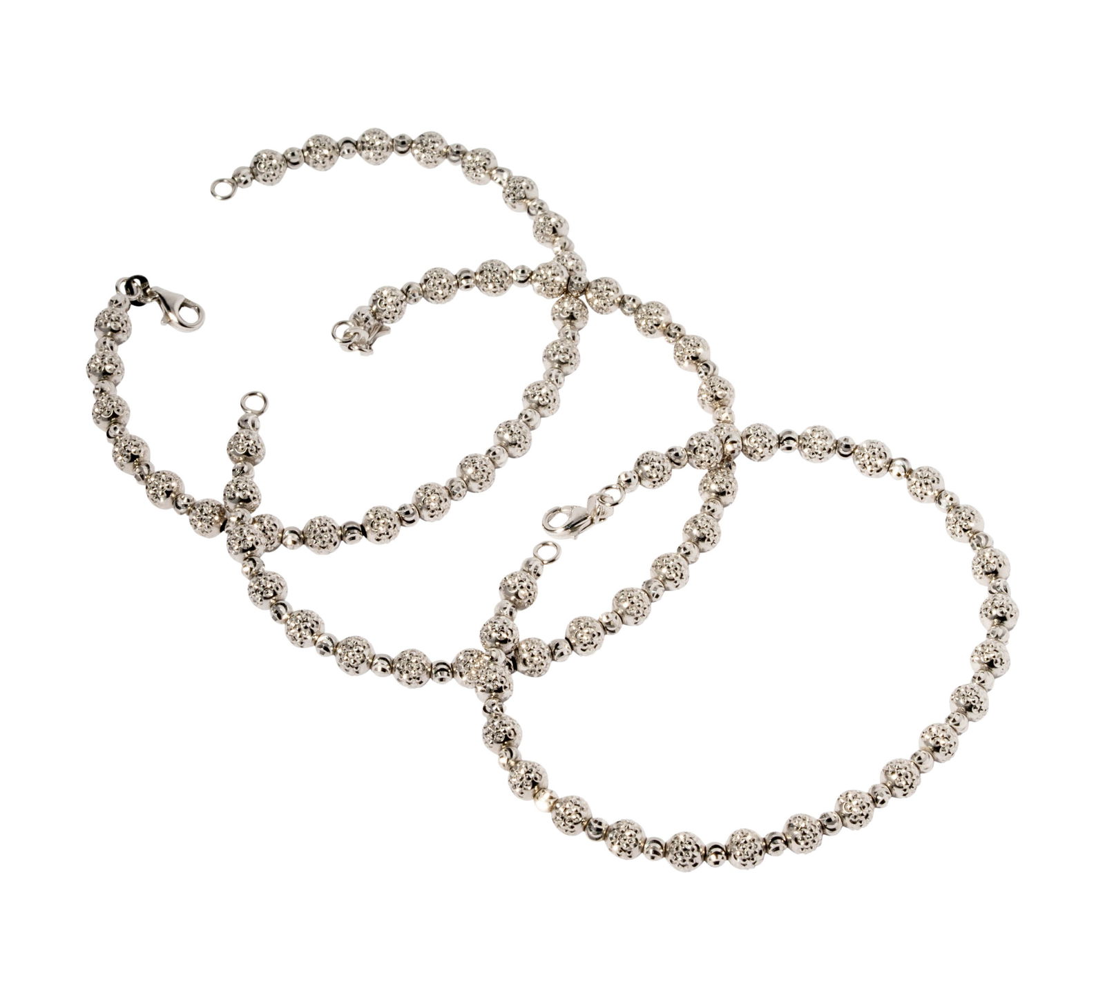 Set of Three 14 Karat White Gold Beaded Bracelets: Including three gold beaded bracelets strung on steel measuring 6-1/2 to 7 inches in length; together weighing 21 grams;