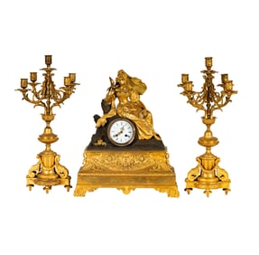 A French Gilt Metal Three-Piece Clock Garniture
