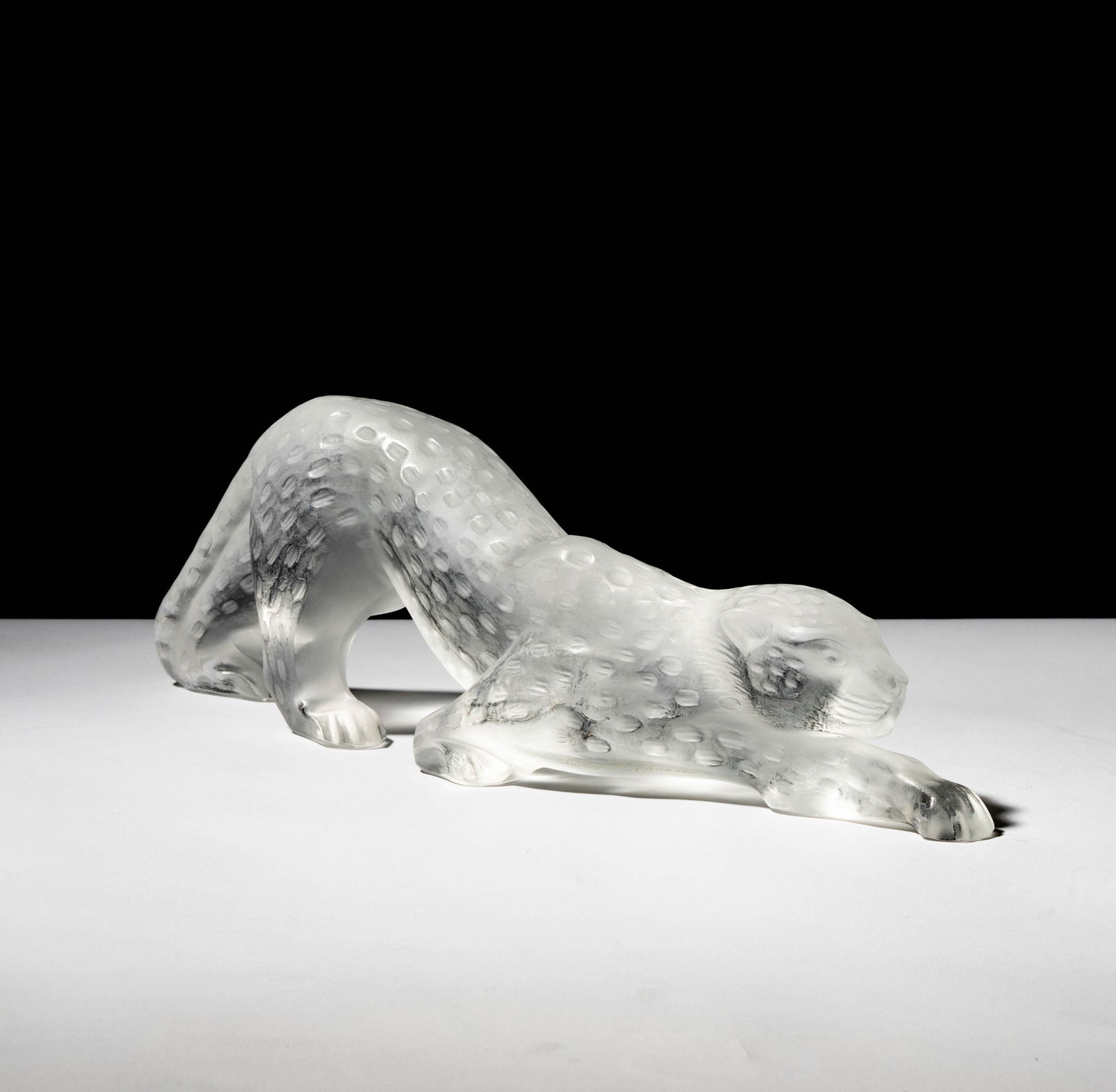 A Lalique Glass Zeila Panther Figure: signed "Lalique France" 4 1/4 x 14 1/2 x 2 1/4 in. (10.8 x 36.8 x 5.7 cm.)