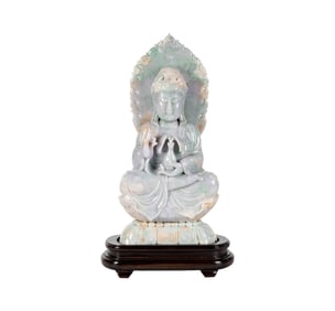 A Chinese Carved Jade Figure of Seated Guan Yin